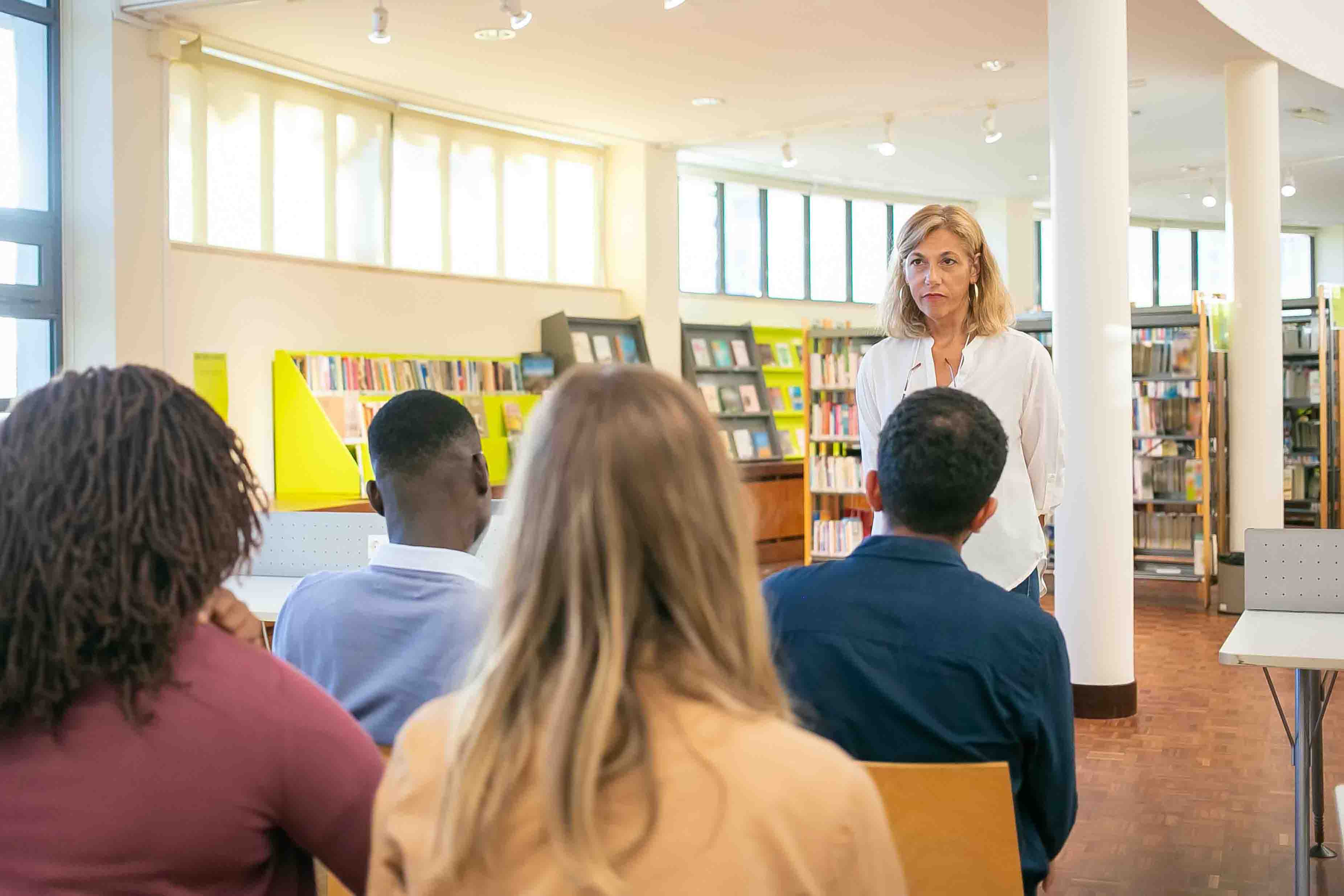 Image of Prof Sheila Widnall holding a lecture in front of an audience.